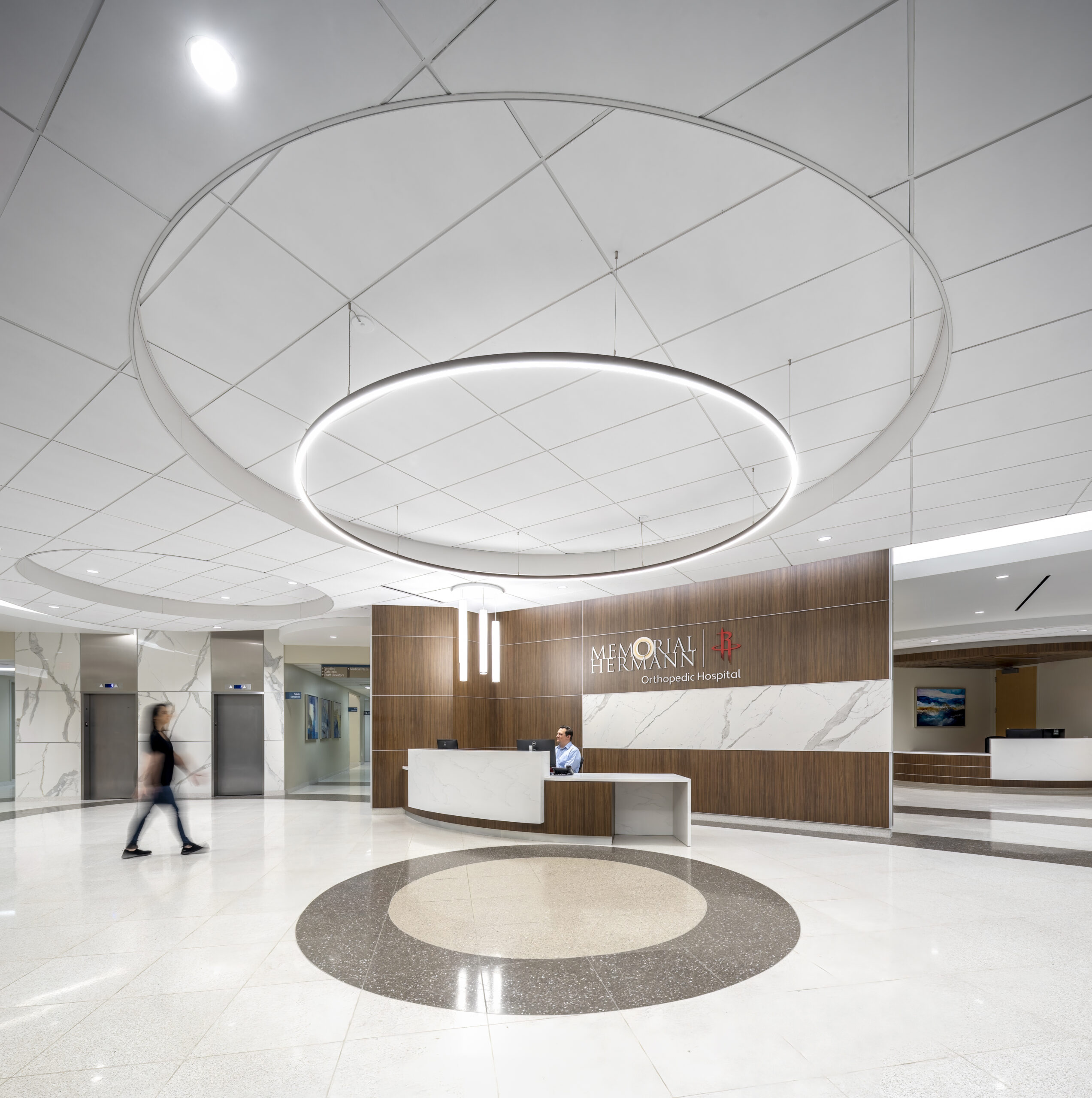 Rocket's orthopedic lobby with Lamiman porcelain panels on curved wall