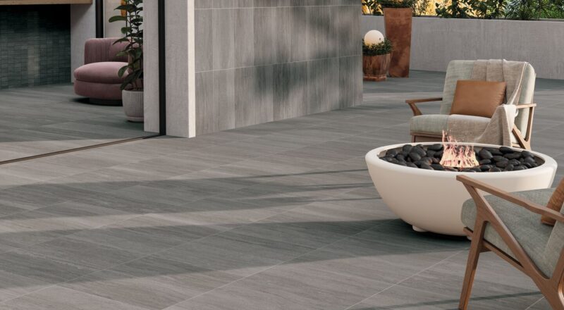 Outdoor hospitality seating ara with firept--decking is Crossville Portland stone, exterior finsih.