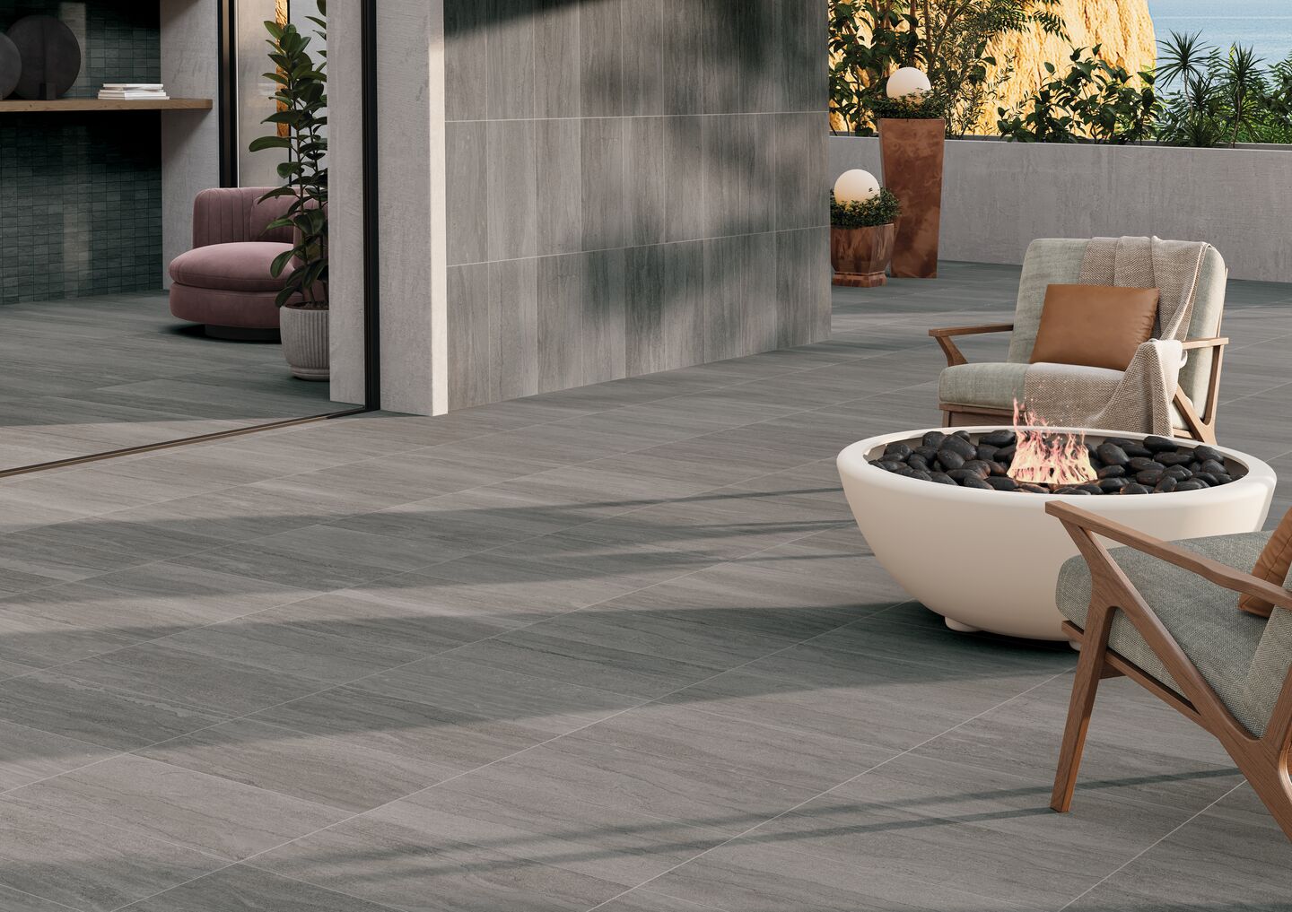 Outdoor hospitality seating ara with firept--decking is Crossville Portland stone, exterior finsih.